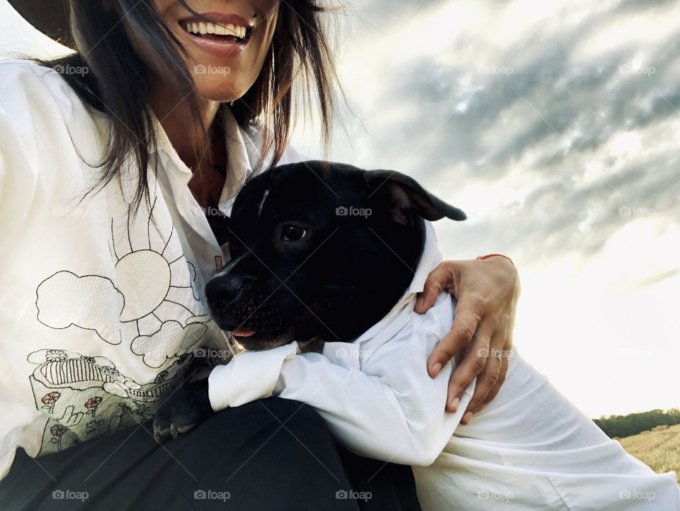 Beautiful girl smiling with her pet