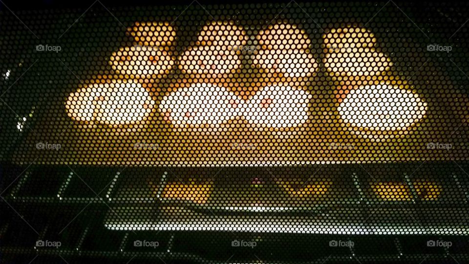 Checking on the cookies in the oven