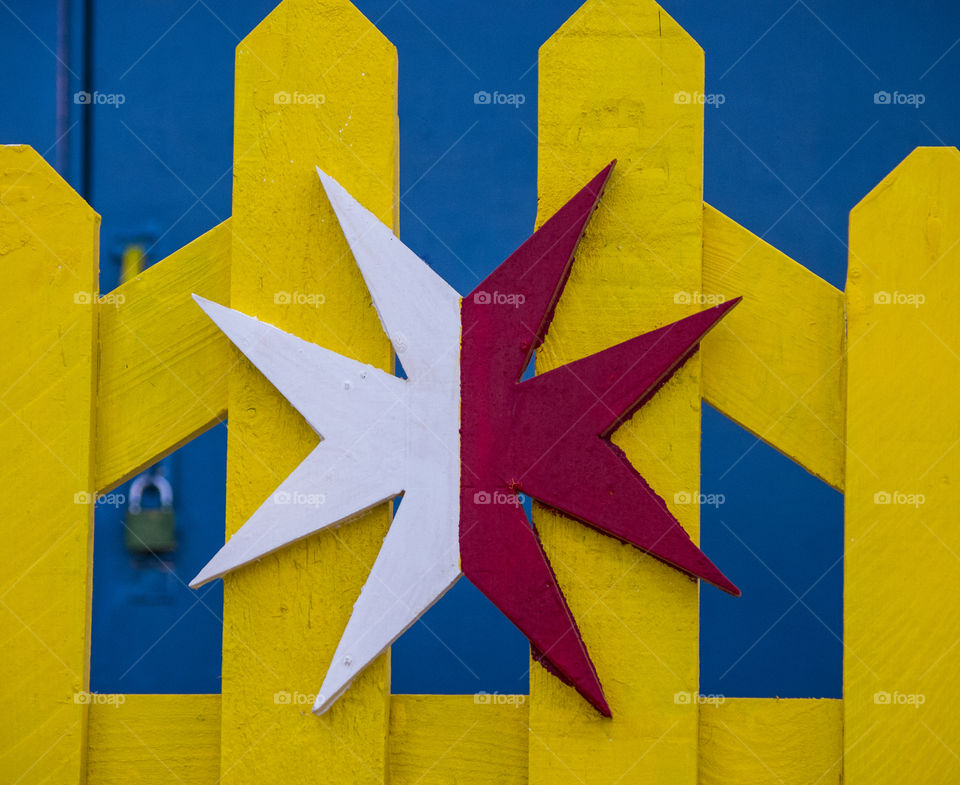 burst of colours. Maltese cross on a gate in valletta