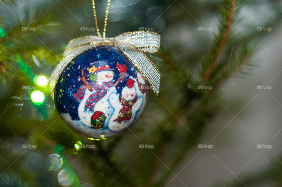 Christmas tree decoration toy with snow men on it 