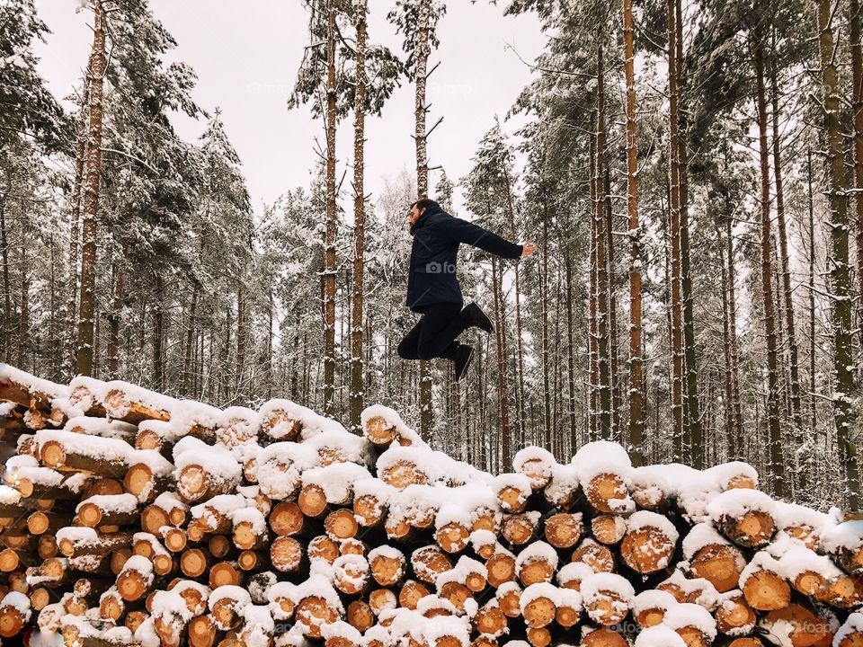 Man jumping over the log