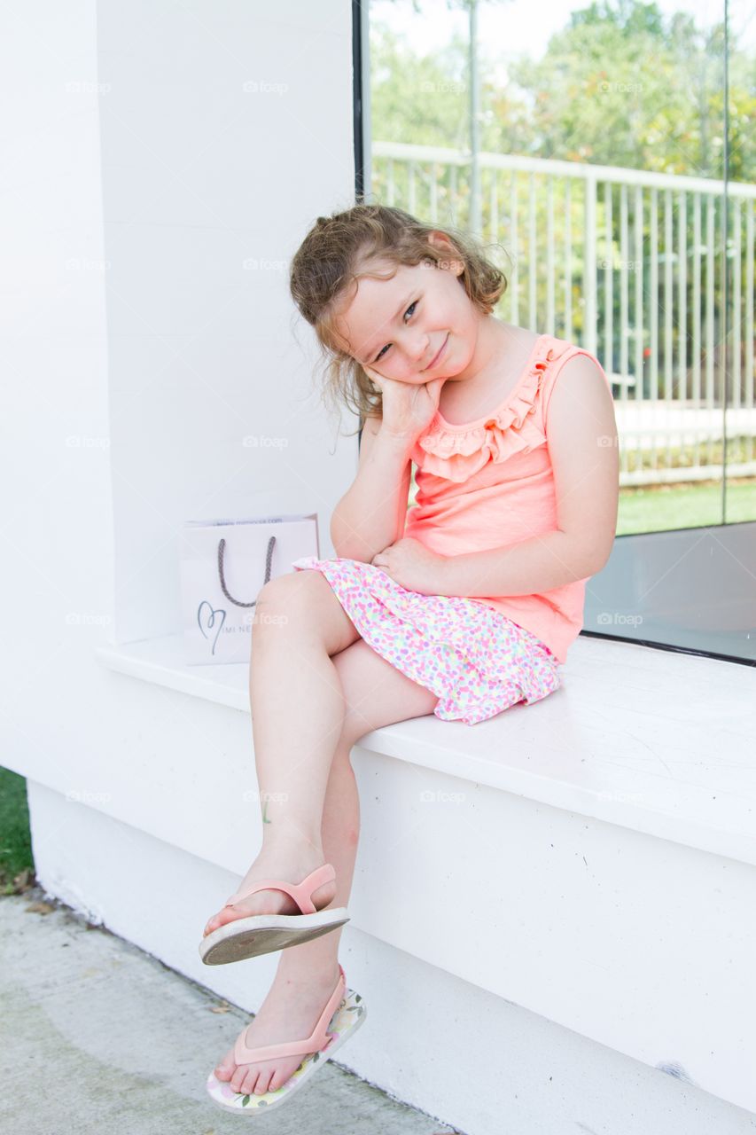 Girl sitting in window