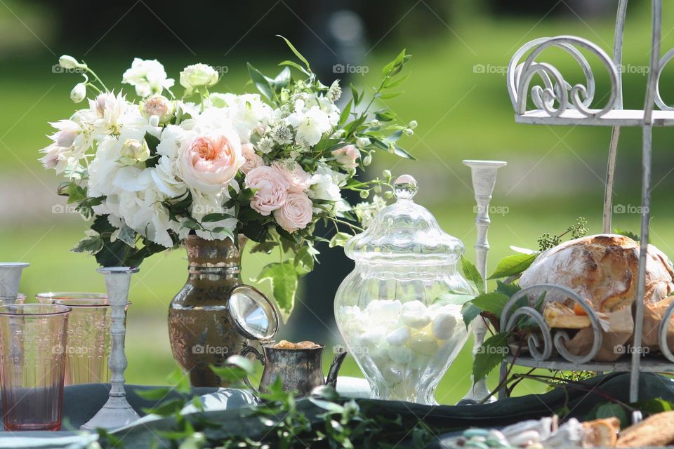 Bouquet of flowers in a vase on a festive decorated table