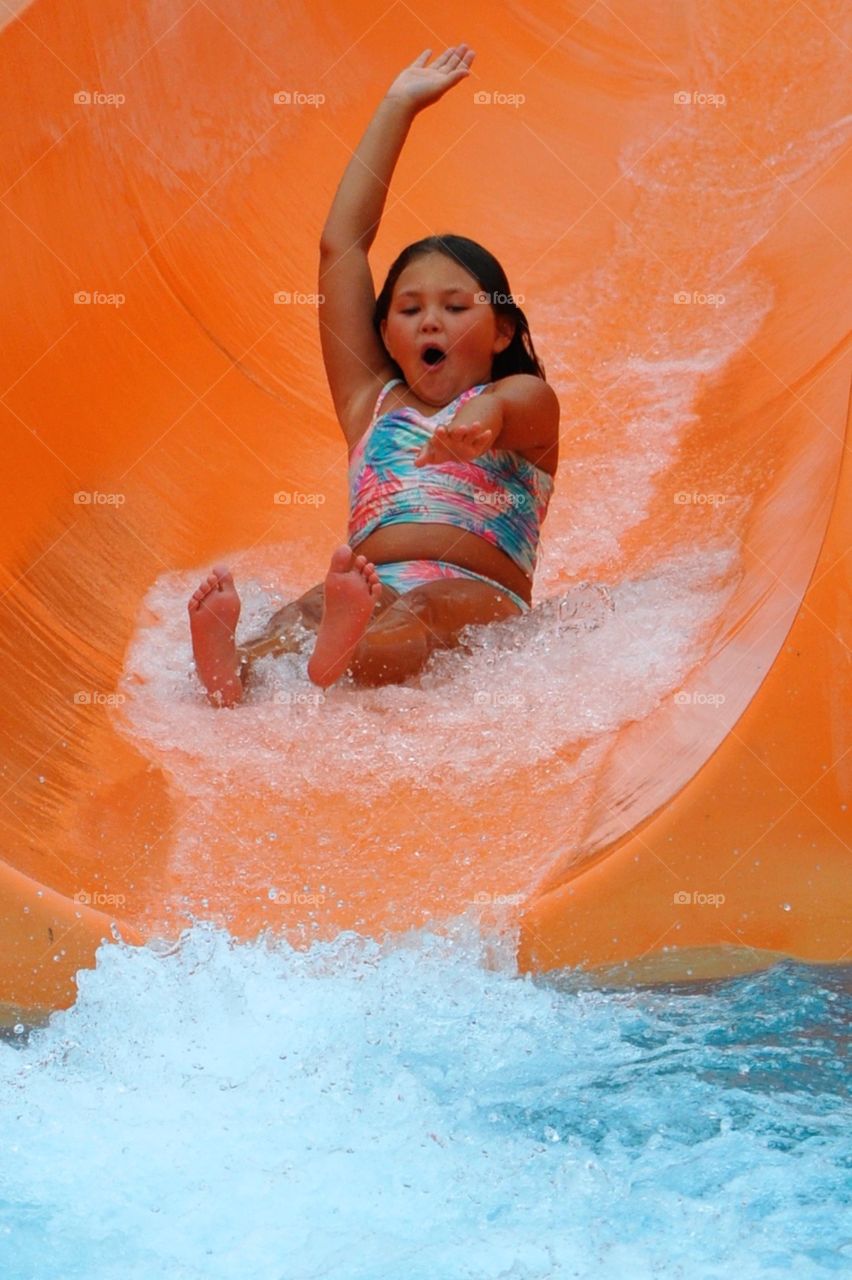 Girl enjoying water slide