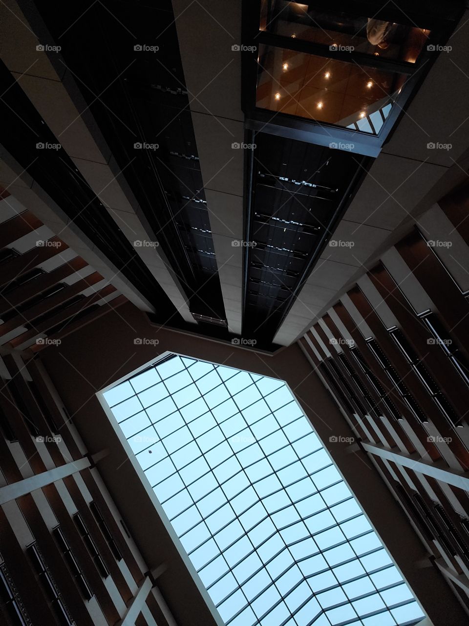 A hotel skylight provides ambient light to the atrium