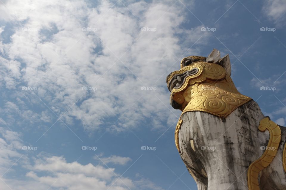 Lion statue with sky