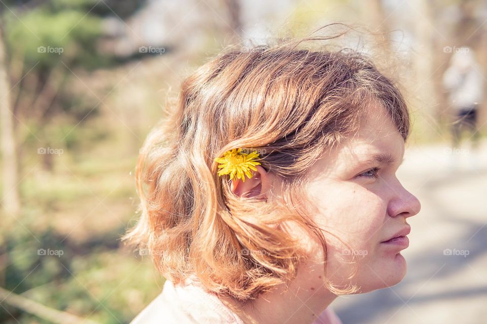 a girl with flower in her hair