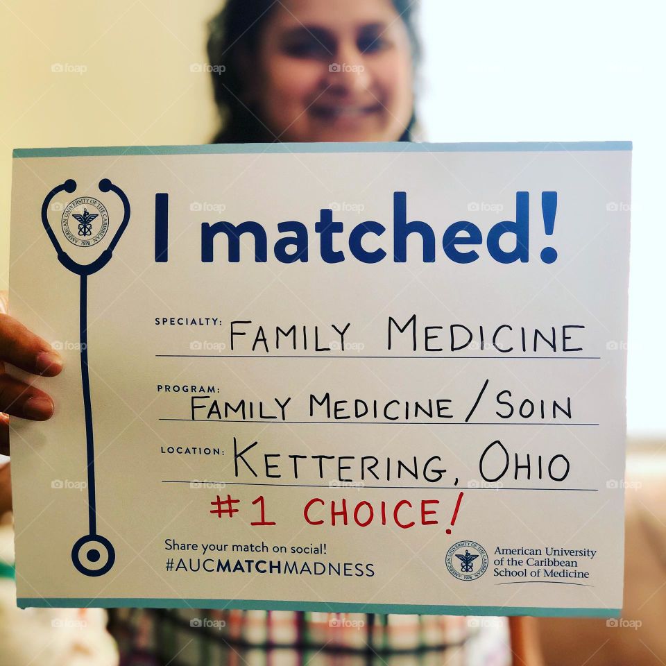 Matching into Residency Program, woman holds sign about match program, becoming a doctor, on the road to becoming a doctor, Ohio Residents 