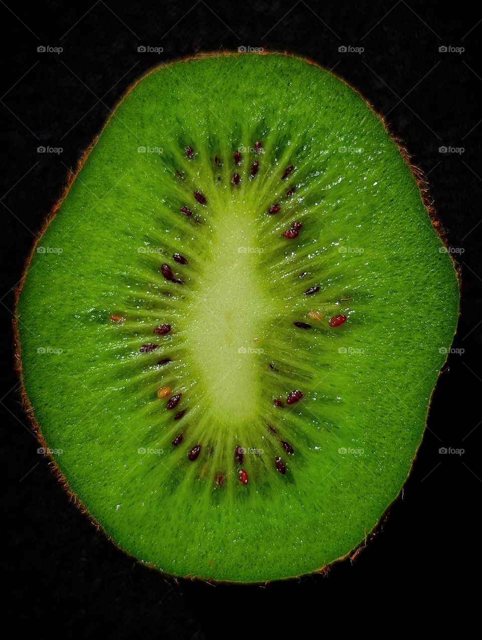 kiwi in a cut on a black background