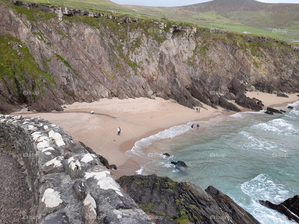 Irish beach and rugged cliffs summer