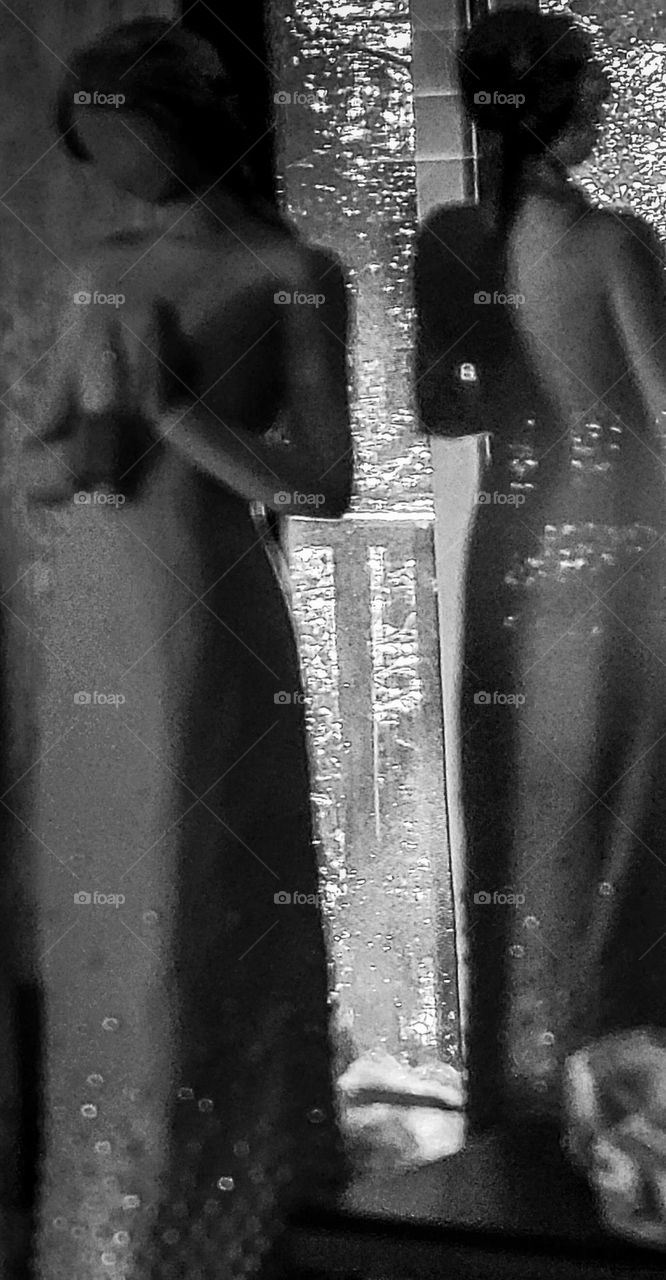 foap mission: angel statue in black and white with sun glistening on the body creating shadows and shapes of calm and beauty