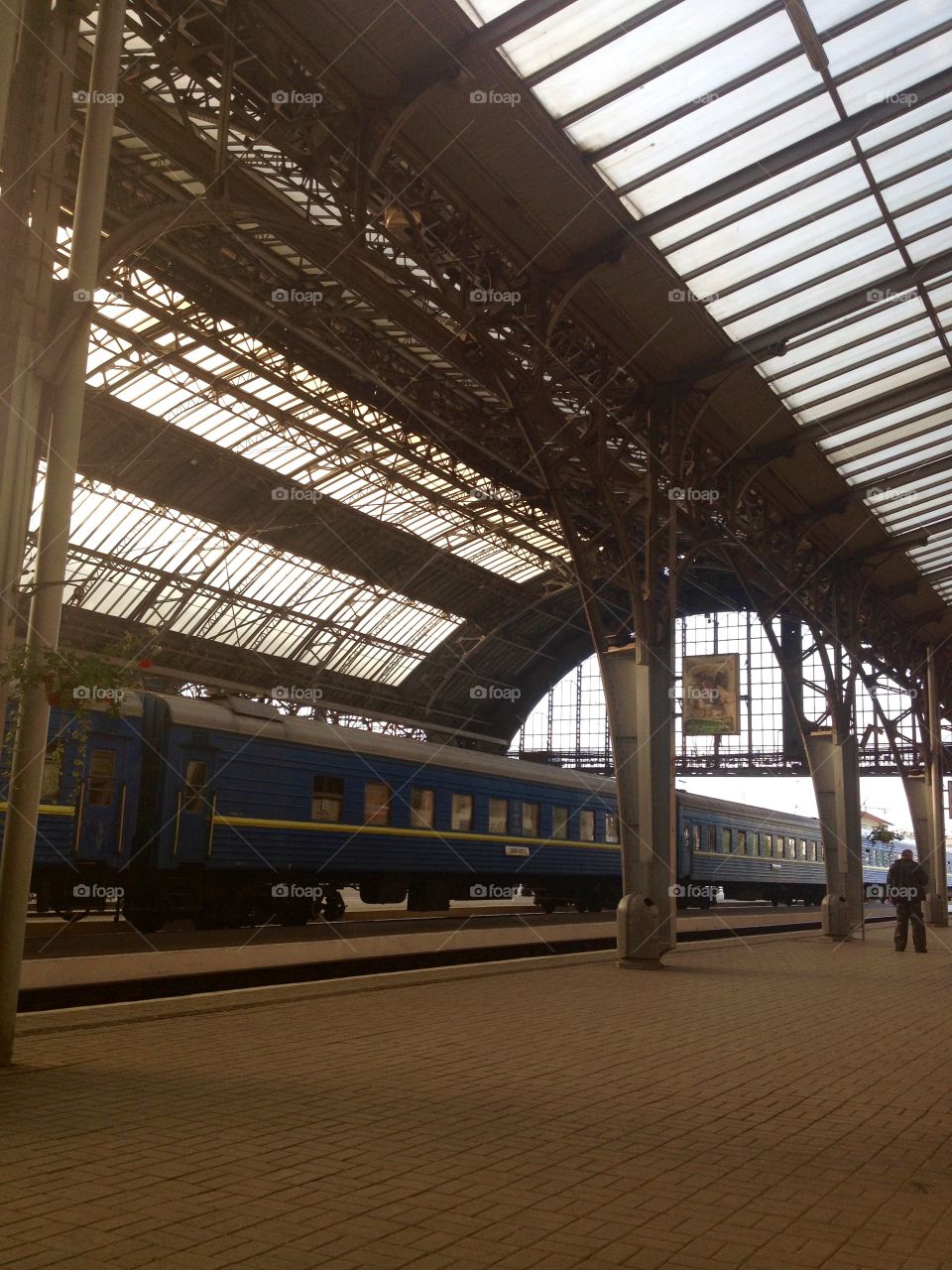 Railway station with a train under roof