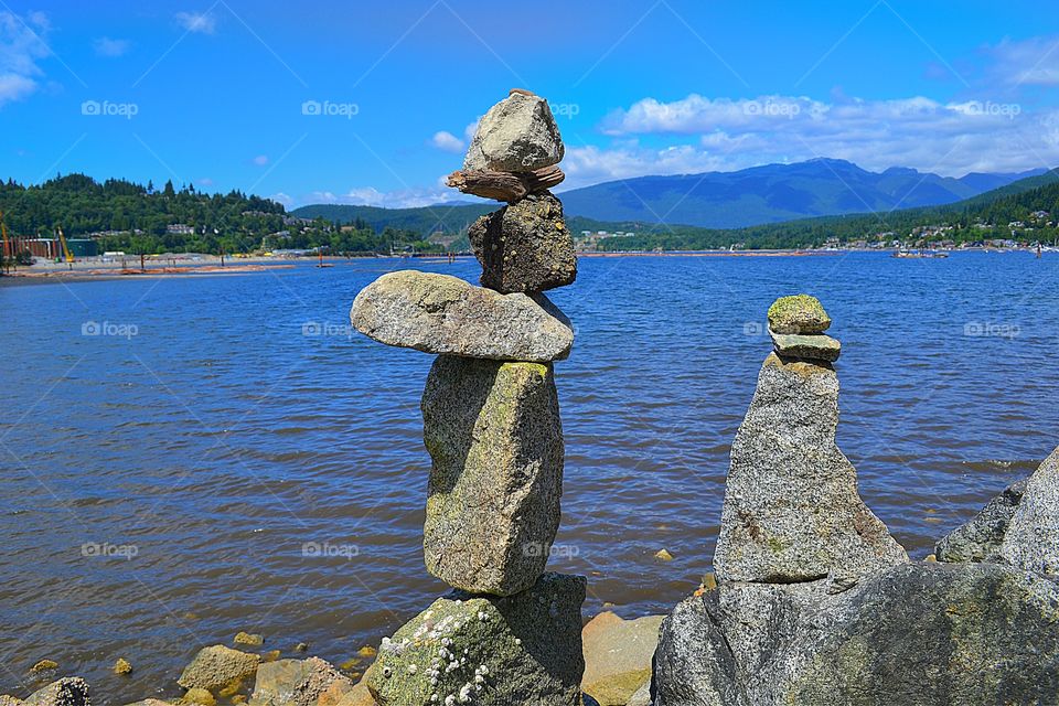 Balancing sticks and stones By Ocean. Balancing sticks and stones art, Inuksuk, cairn