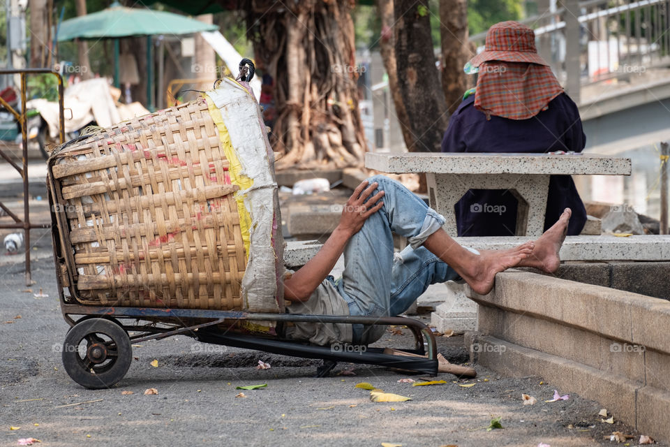 Easy life ...Simple happiness of a man who sleep in basket