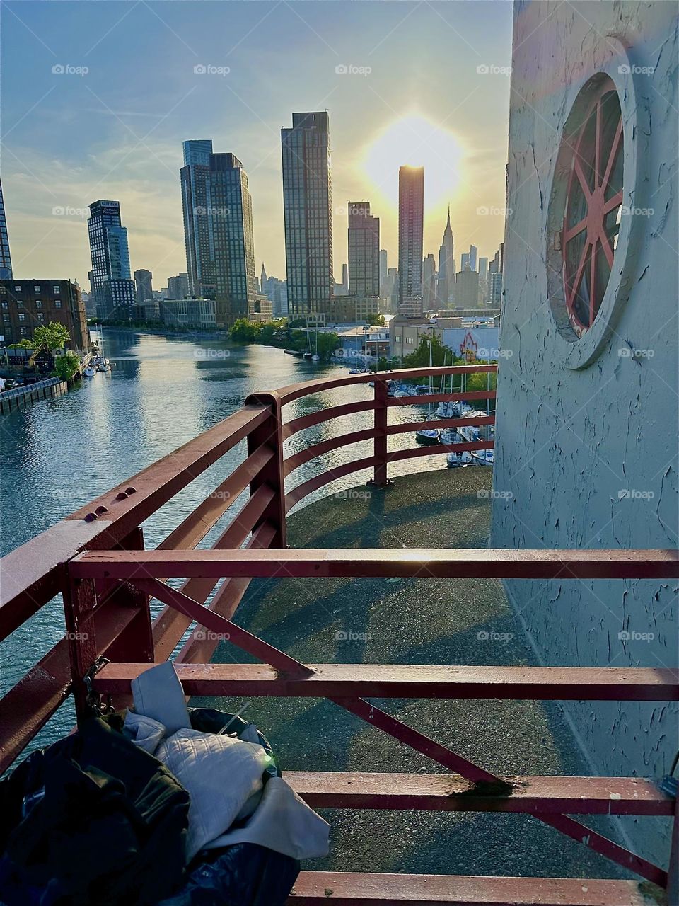 This is the central outpost of the “Pulaski Bridge” that connects “Greenpoint”, Bklyn to LIC, Queens overlooking “Newtown Creek”. Across the “East River” we see “Manhattan” including the “Empire State Building”. 2024. Hypnotic Productions