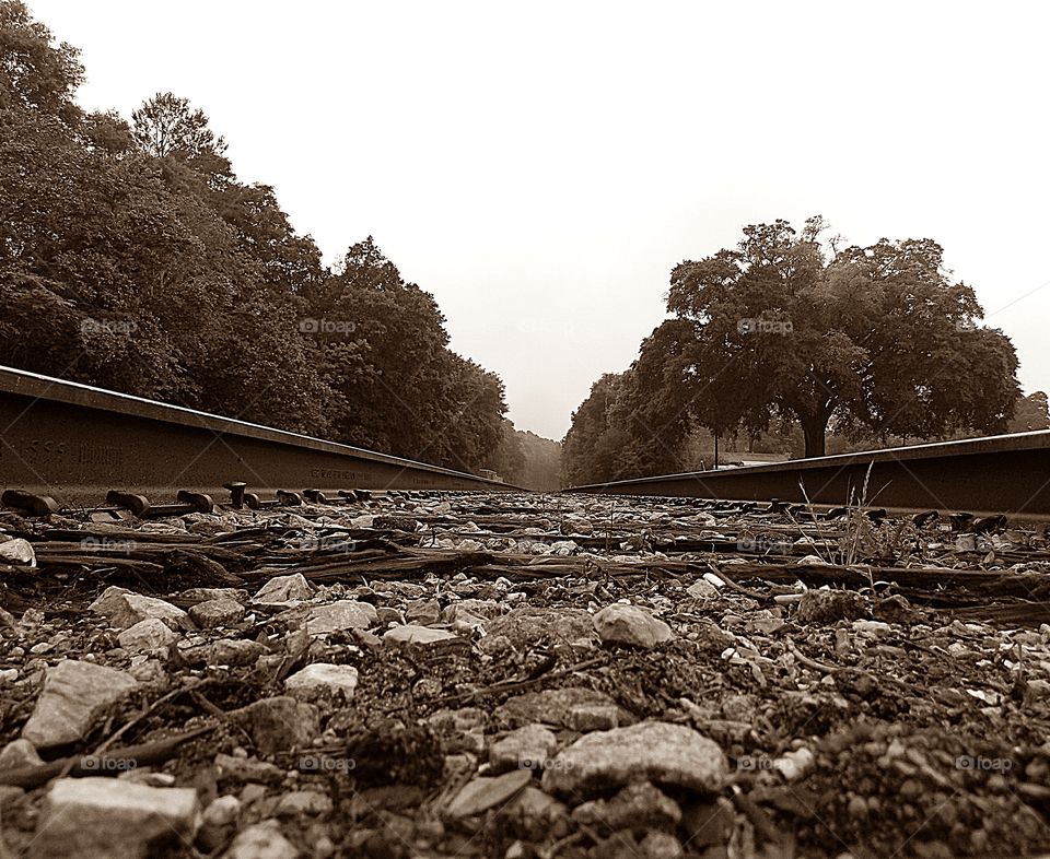 Between the tracks - a birds eyes view of what objects are on the ground between the railroad tracks