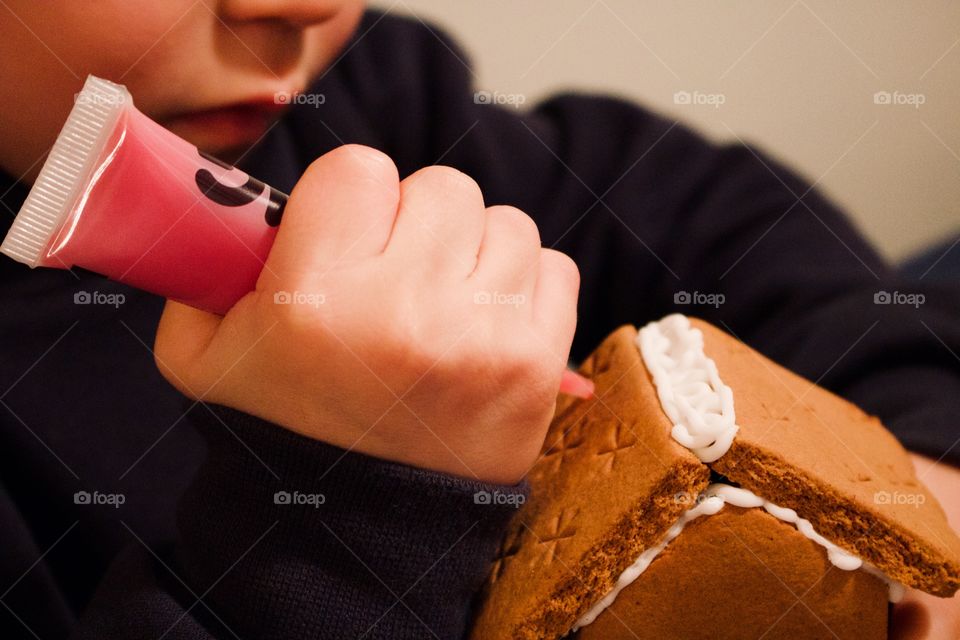 Decorating the gingerbread house for Santa