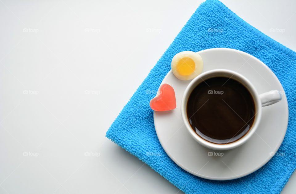 coffee mug and sweet on a white background top view