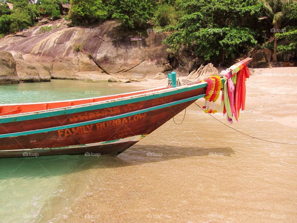 Bright Colorful Boat on a Thai Beach
