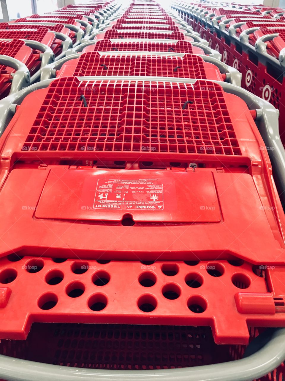 Patterns and shapes in rows of shopping carriages 