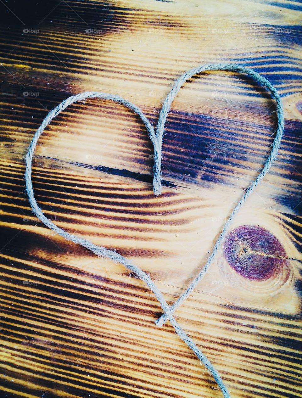 Heart. A string heart on wood