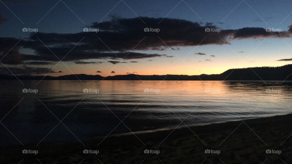 The calm ripples of the lake with an reflect of the sunset. 