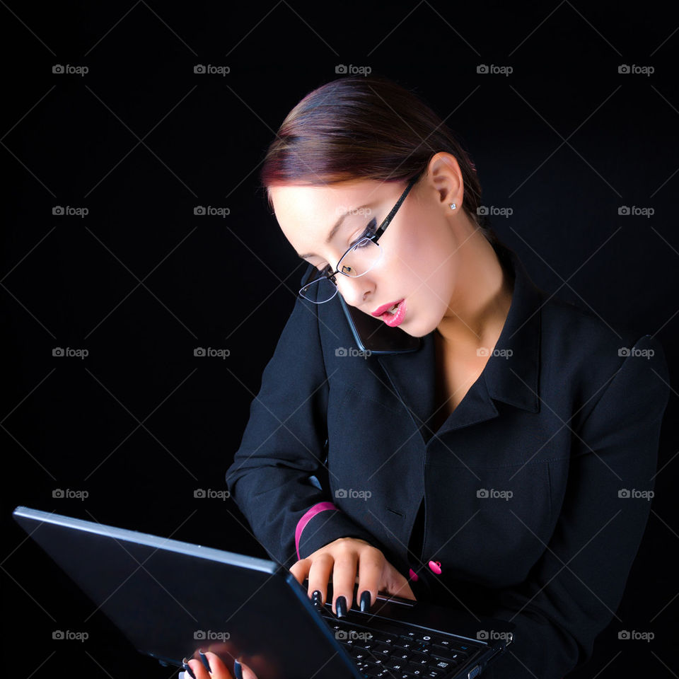Woman With Phone and Laptop