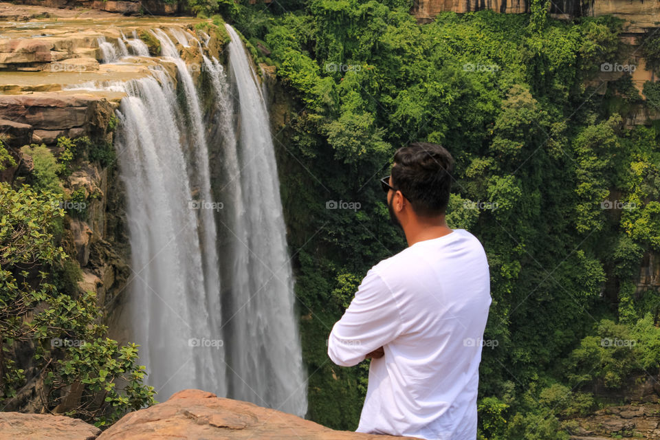 Standing near a water enjoying the cold breeze is a best of moods in summer