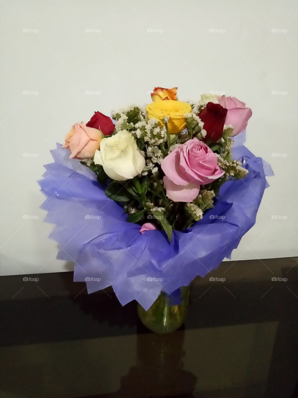 Fresh Flowers Bouquet gifted on a celebration occasion with different coloursof roses.