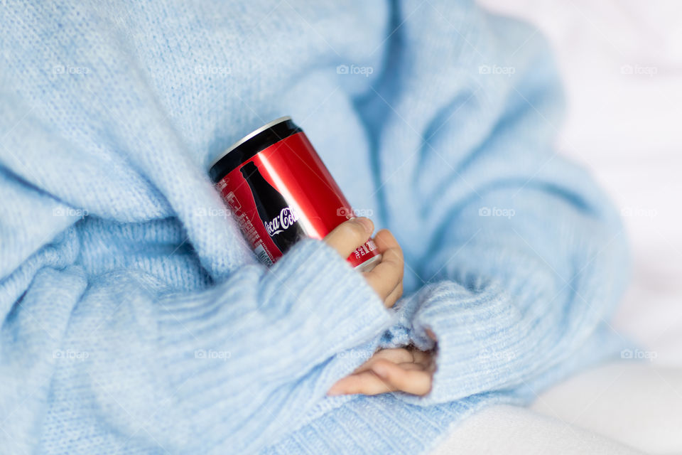 Girl holding hands Coca Cola 