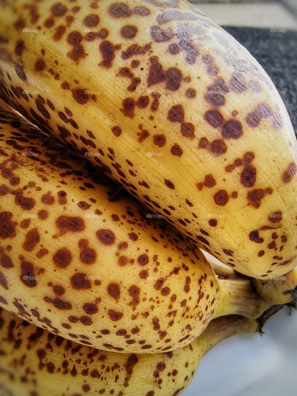 very ripe nanica banana, yellow peel all painted.