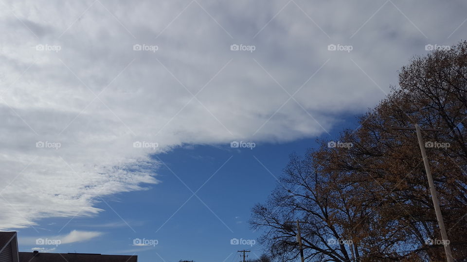 puffy white clouds blue sky