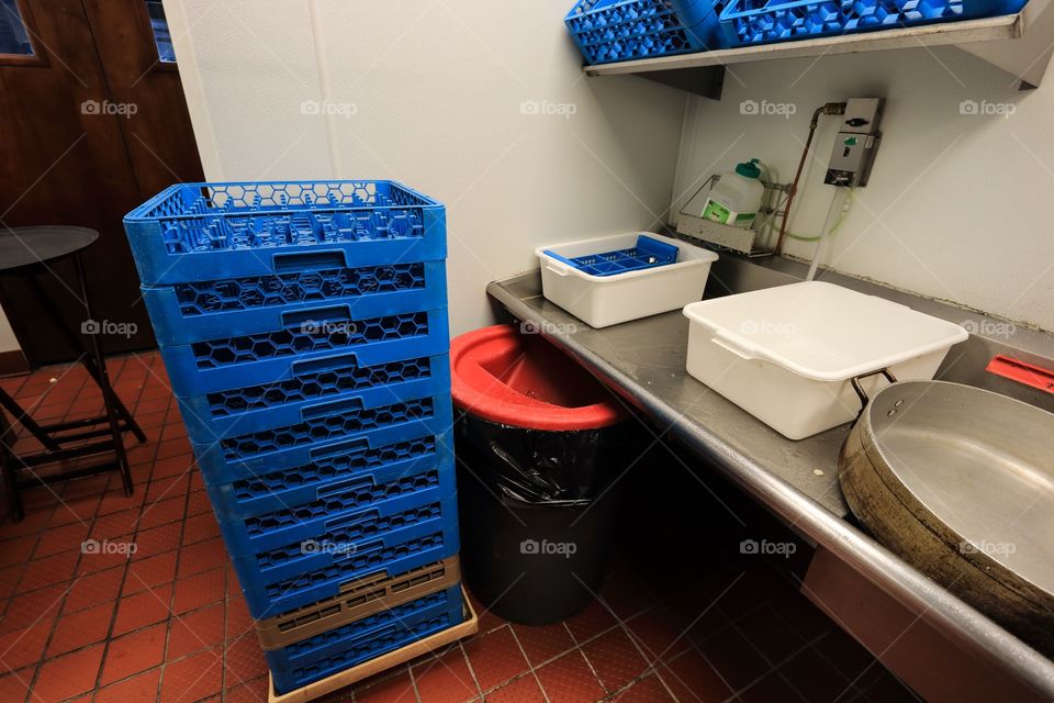 Kitchen storage cleaning equipment inside the restaurant 