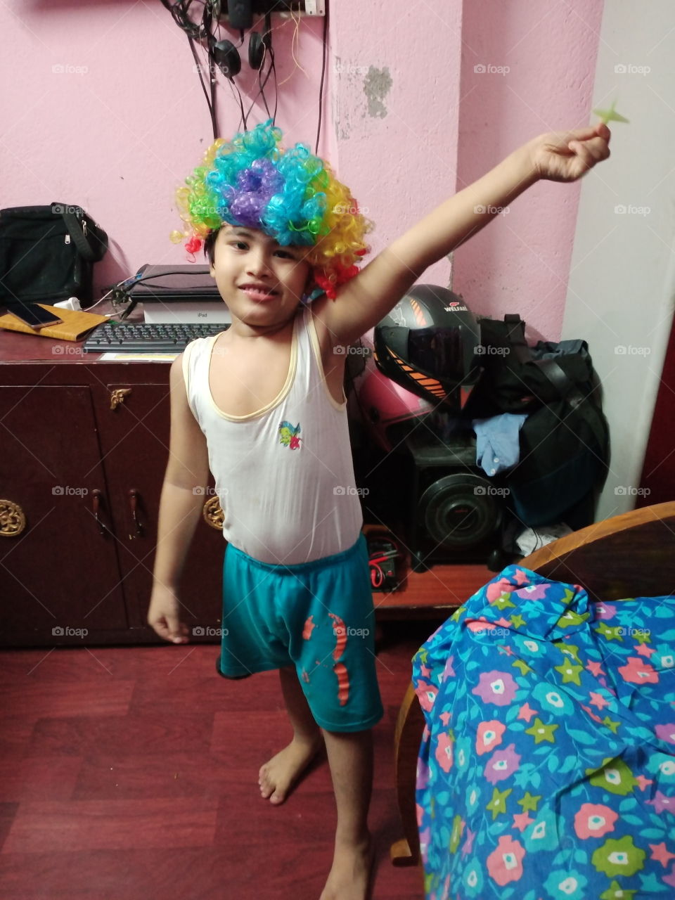 baby with rainbow cap