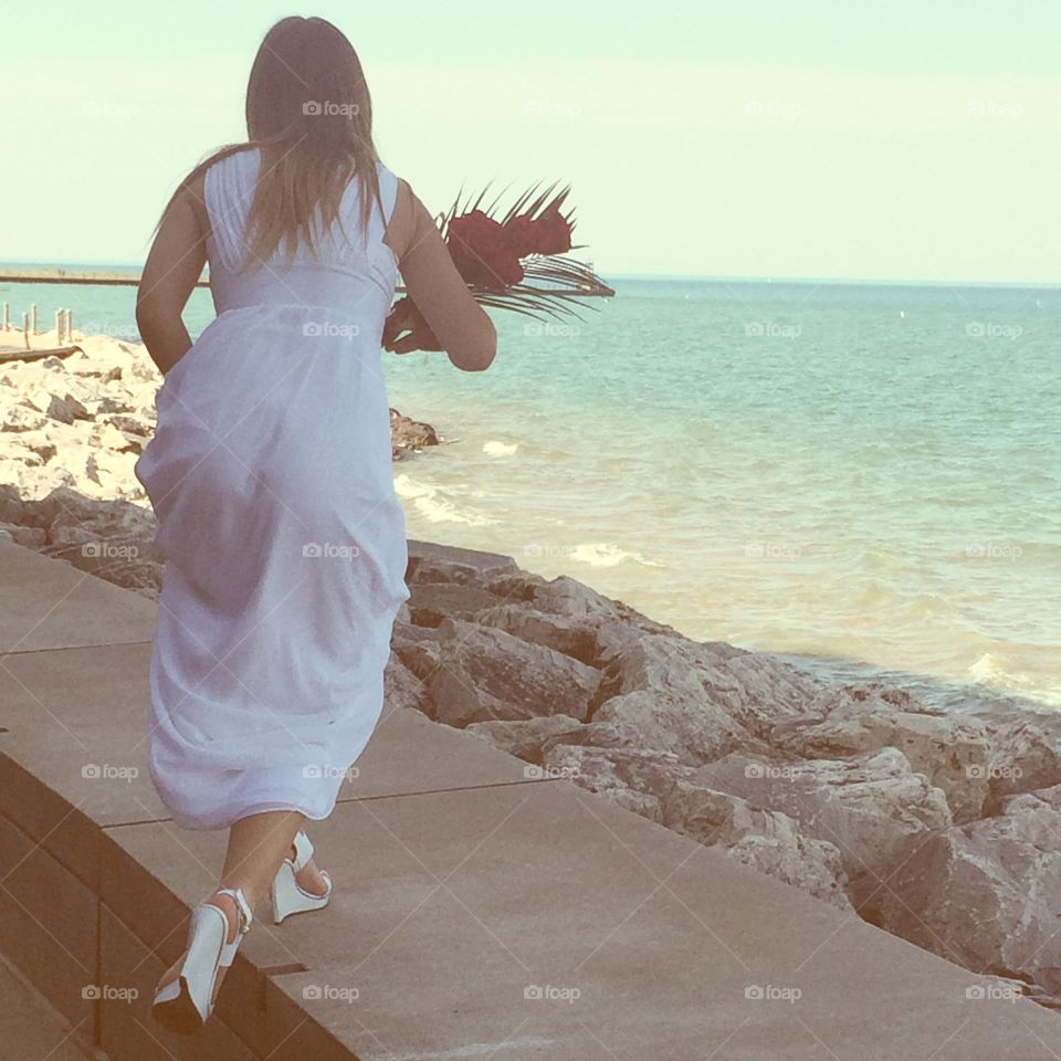 Runaway Grad. My little sister just graduated. We took pictures and I captured a shot f her looking like a runaway bride.