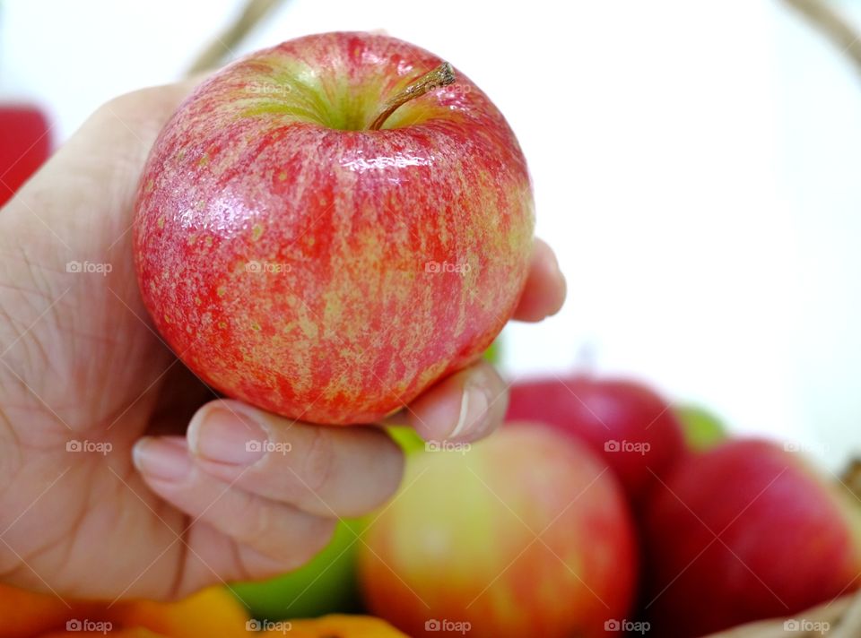Woman hand holding apple