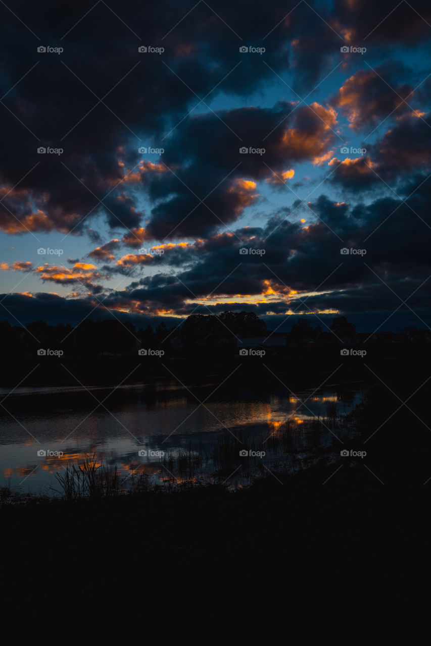 Sunset with a pond in front 