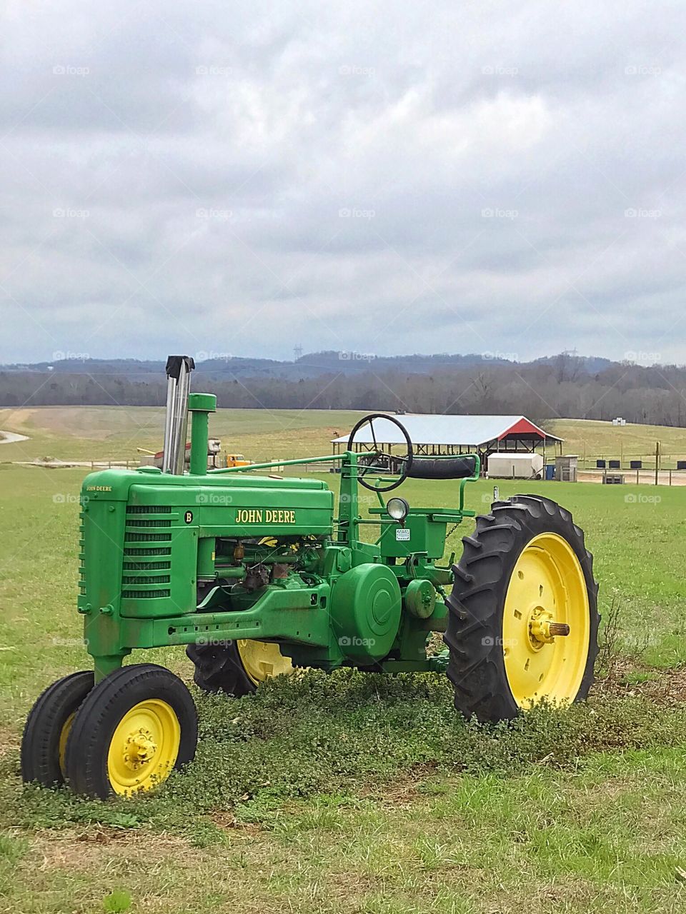 John Deere Tractor on a Hillside Farm