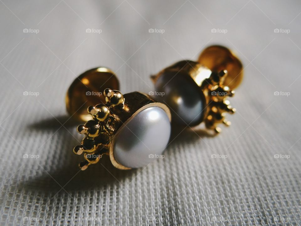 Pearl studded gold ear studs