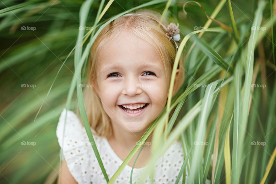 Little Caucasian girl feeling happiness outdoor 