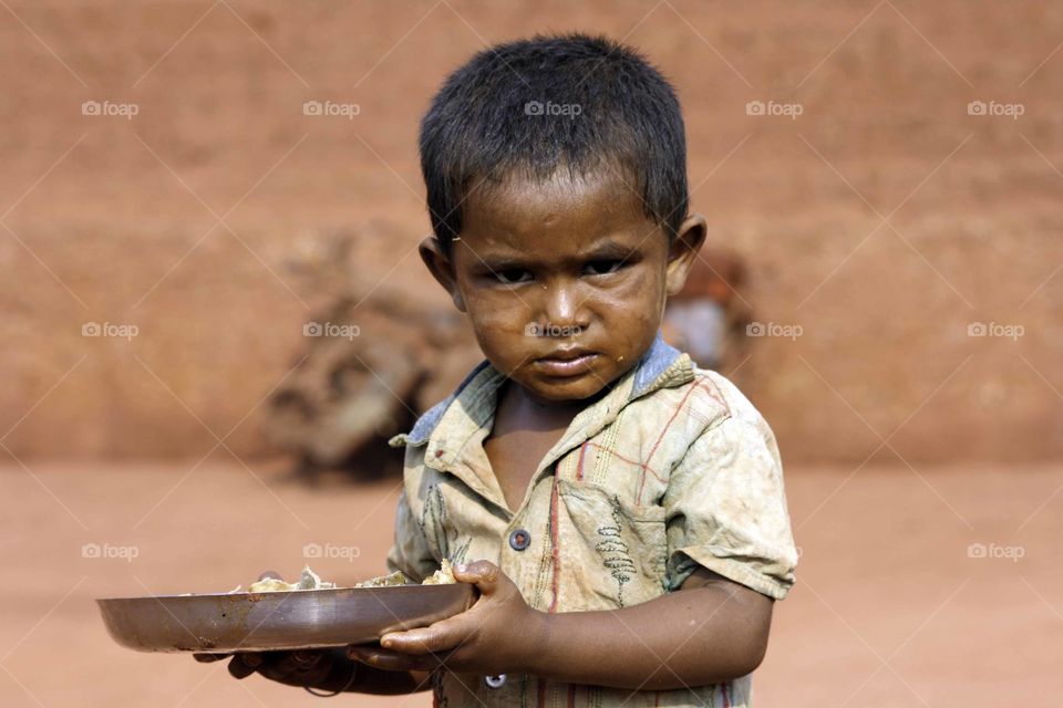 poverty kills
a boy of mine worker 
hungry face