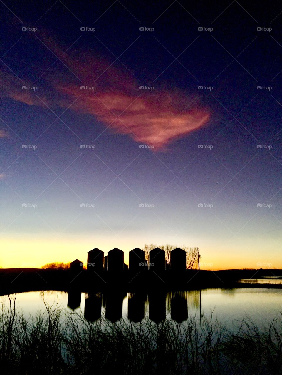 Amazing grain bin sunset reflection 
