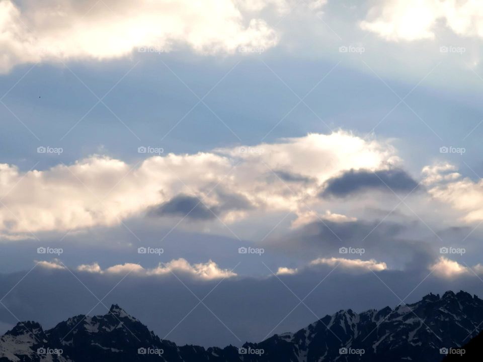 Clouds cover on peaks in evening