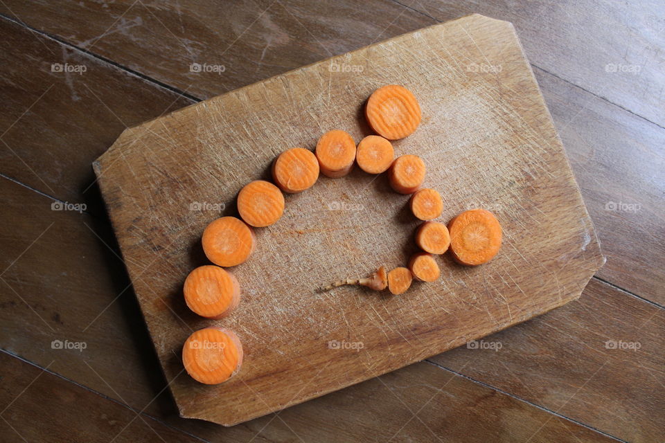 cut carrot on wooden table