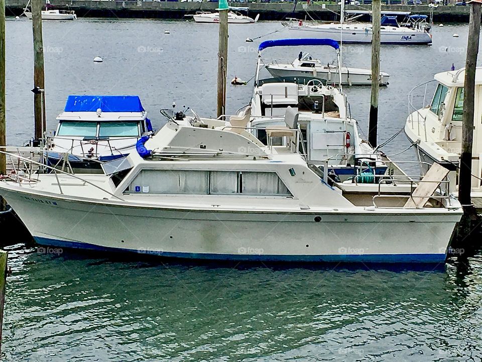 Boats in the waters of the East River at Newtown Creek in Long Island City, Queens, New York photographed in 2018. Hypnotic Productions