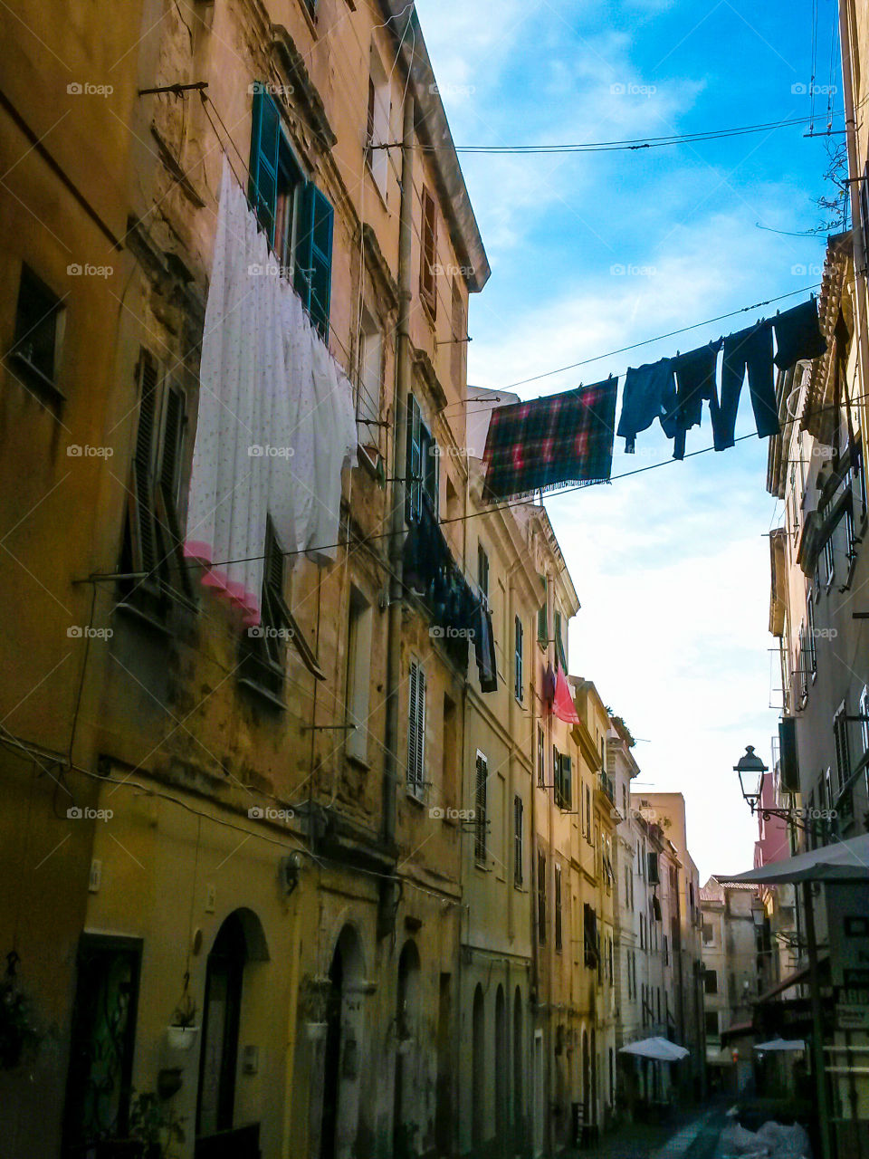 drying clothes in the narrow street of old center city. Alghero Sardinia