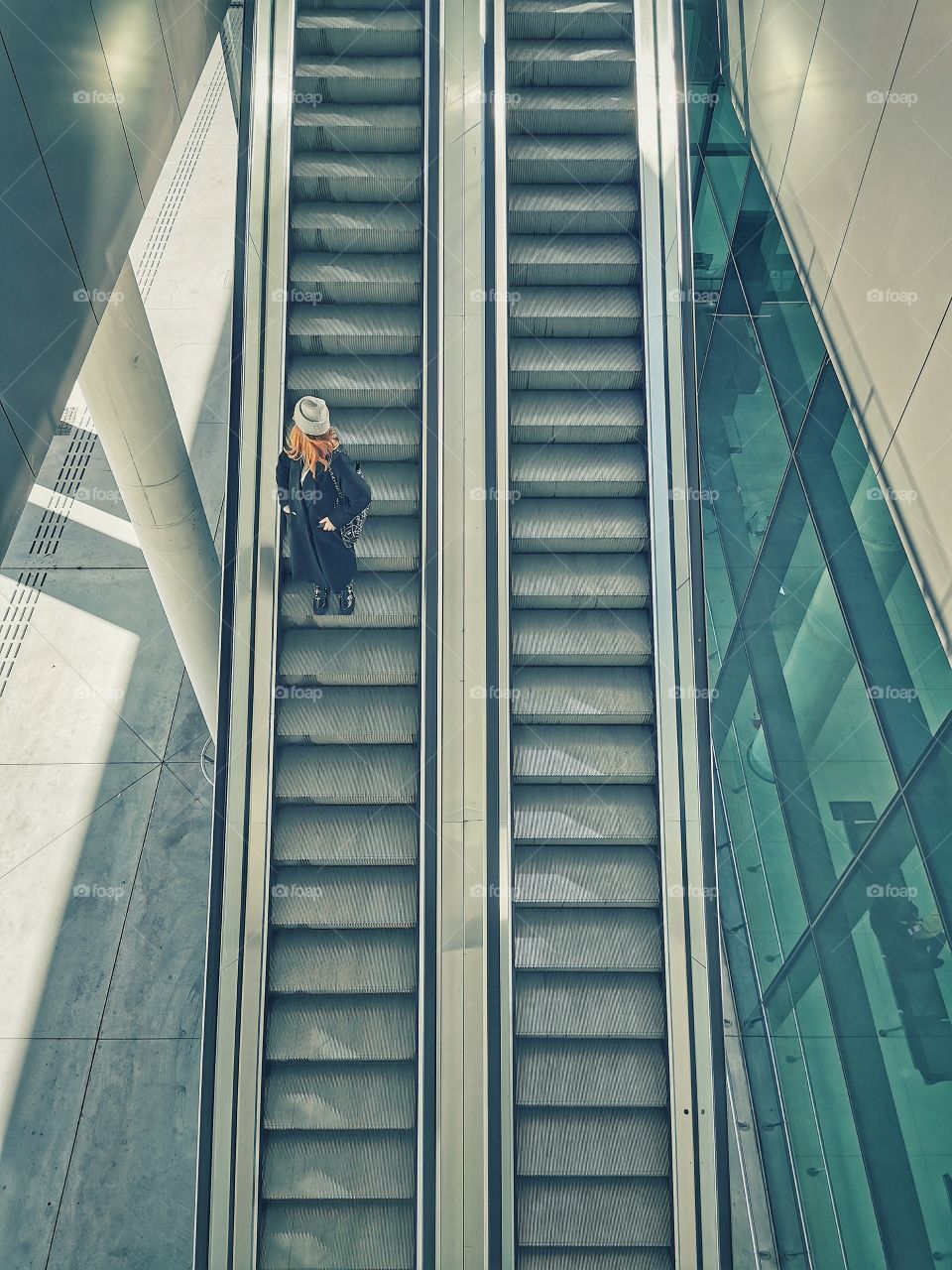 Woman on the metal stairs