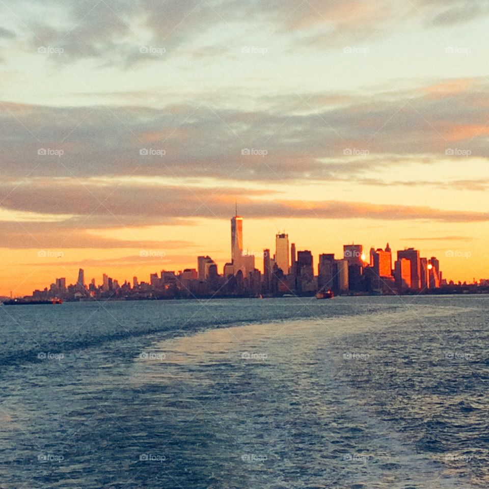 Manhattan sunrise photographed from the Staten Island ferry, New York, United States of America.