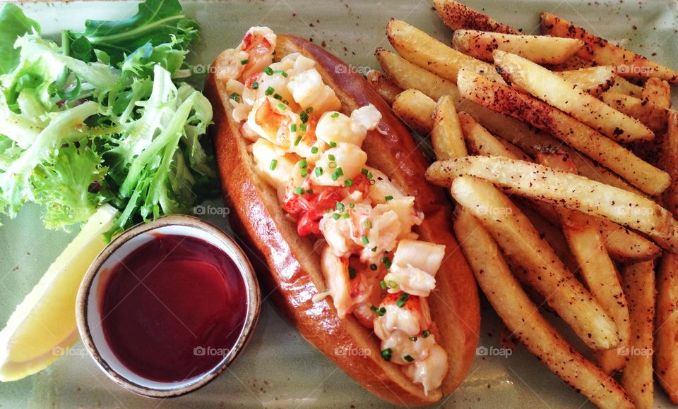 Lobster roll with fries and ketchup