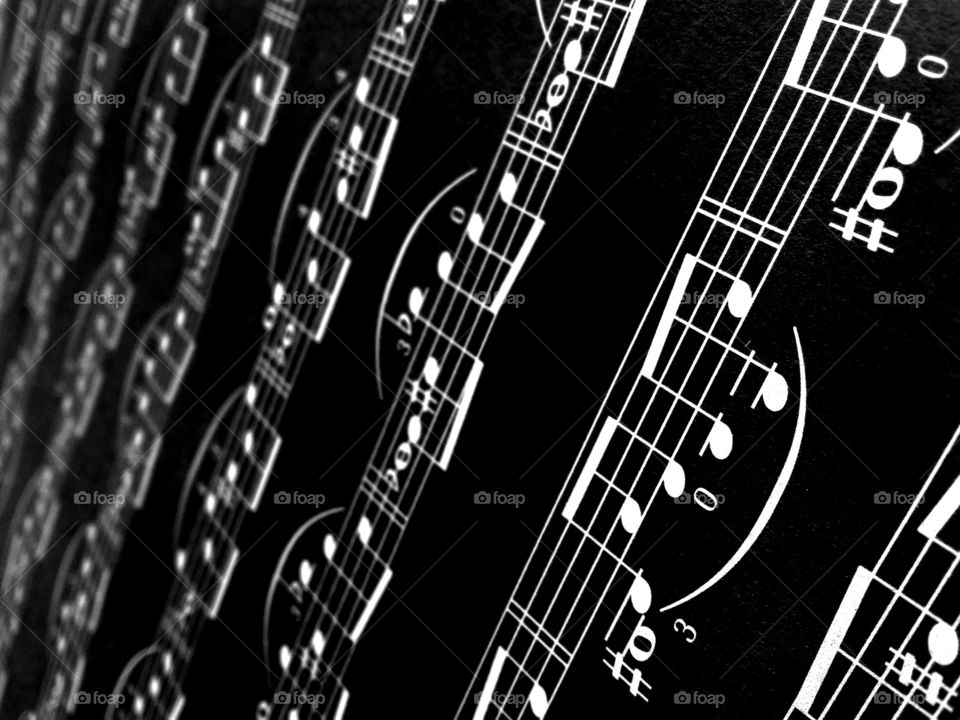 Musical note against black background